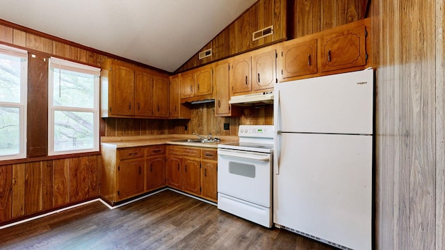 kitchen featuring vaulted ceiling, white appliances, light countertops, under cabinet range hood, and a sink