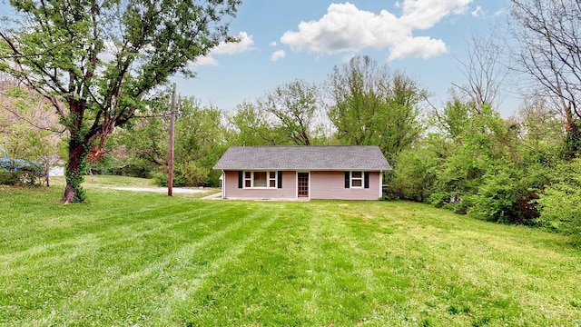back of house with a lawn