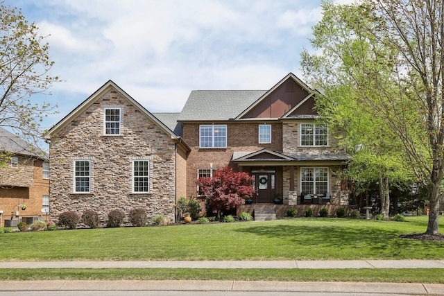 1702 Stoney Hill Ln, Spring Hill, TN 37174 - craftsman-style home with stone siding and a front yard