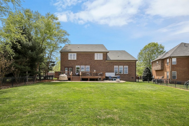 1702 Stoney Hill Ln, Spring Hill, TN 37174 - back of house featuring a wooden deck, a fenced backyard, brick siding, and a yard