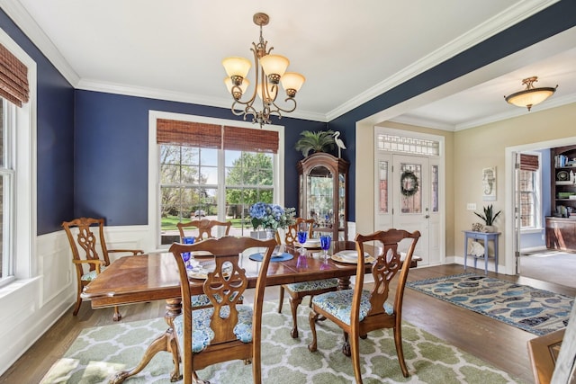 1702 Stoney Hill Ln, Spring Hill, TN 37174 - dining space with wood finished floors, a chandelier, and ornamental molding