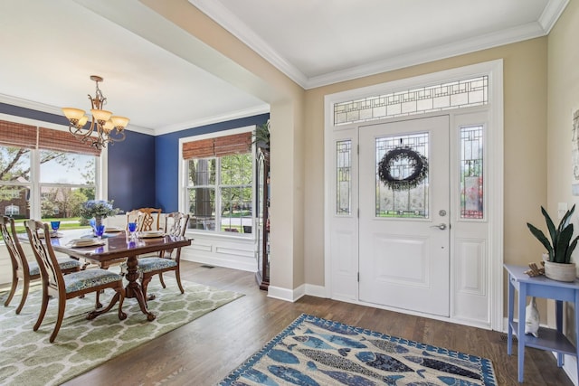 1702 Stoney Hill Ln, Spring Hill, TN 37174 - entrance foyer with wood finished floors, visible vents, ornamental molding, baseboards, and a chandelier