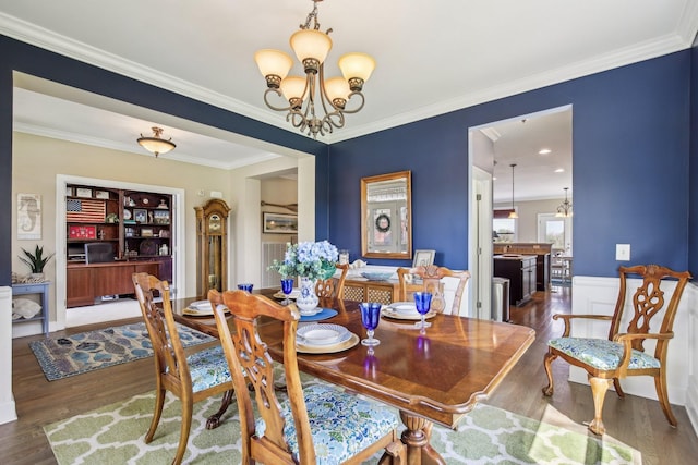 1702 Stoney Hill Ln, Spring Hill, TN 37174 - dining room featuring wood finished floors, a notable chandelier, ornamental molding, and built in shelves