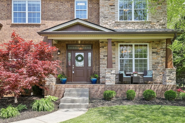 1702 Stoney Hill Ln, Spring Hill, TN 37174 - property entrance with brick siding, a porch, and stone siding