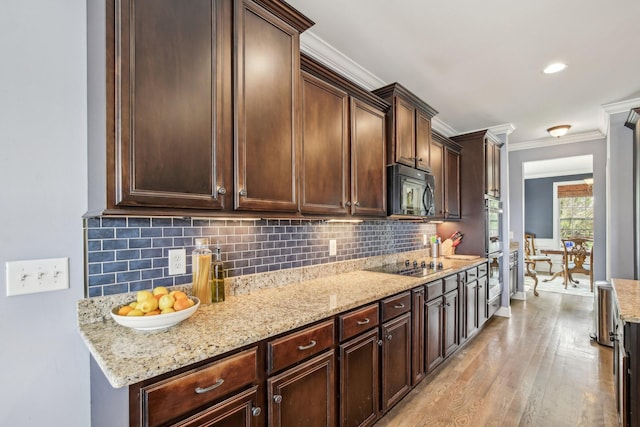1702 Stoney Hill Ln, Spring Hill, TN 37174 - kitchen with light stone counters, dark brown cabinets, ornamental molding, black appliances, and light wood-style flooring