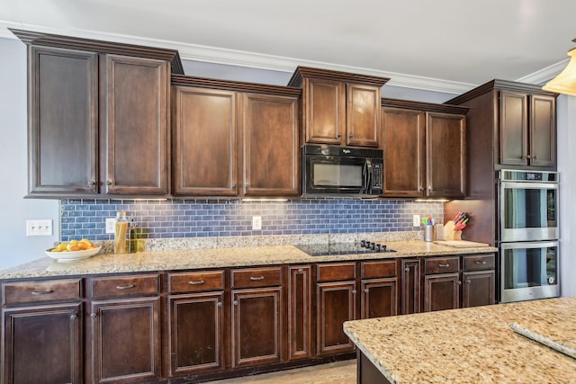 1702 Stoney Hill Ln, Spring Hill, TN 37174 - kitchen with light stone counters, dark brown cabinetry, black appliances, and tasteful backsplash
