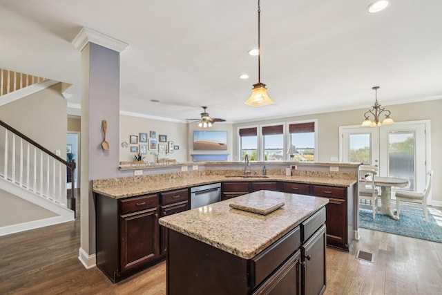 1702 Stoney Hill Ln, Spring Hill, TN 37174 - kitchen featuring a center island, dishwasher, wood finished floors, and a sink