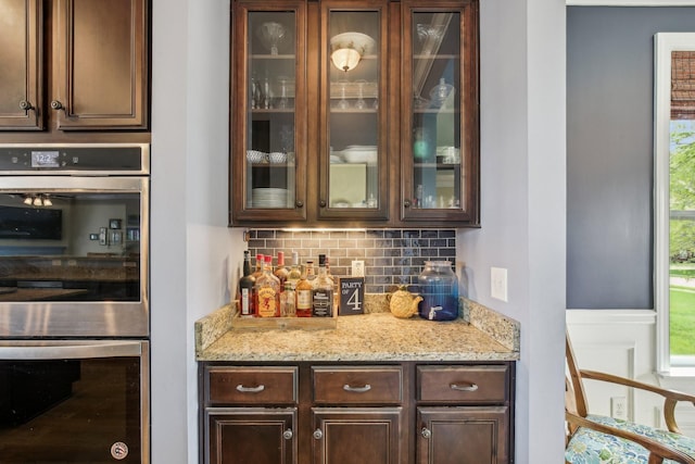 1702 Stoney Hill Ln, Spring Hill, TN 37174 - bar featuring stainless steel double oven, a dry bar, and decorative backsplash