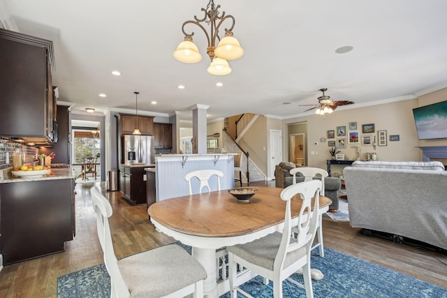 1702 Stoney Hill Ln, Spring Hill, TN 37174 - dining room featuring stairway, crown molding, ceiling fan, dark wood finished floors, and recessed lighting
