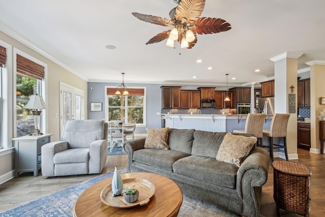 1702 Stoney Hill Ln, Spring Hill, TN 37174 - living area with wood finished floors, crown molding, and a ceiling fan