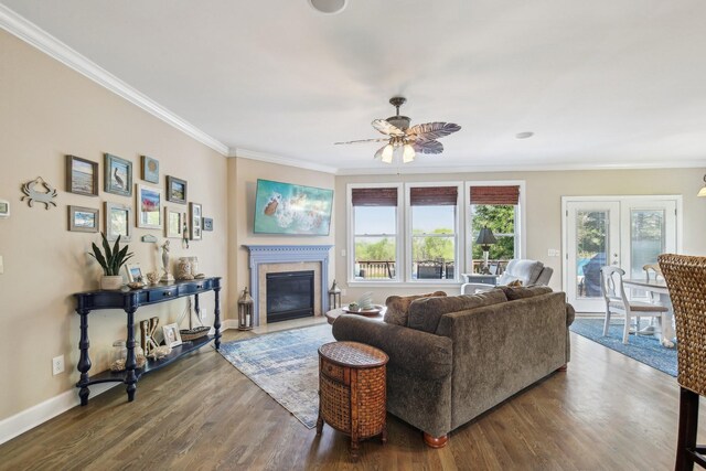 1702 Stoney Hill Ln, Spring Hill, TN 37174 - living area with dark wood finished floors, baseboards, a glass covered fireplace, ceiling fan, and crown molding