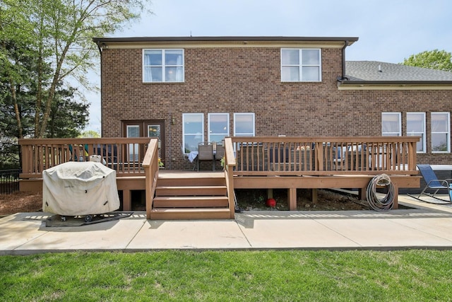 1702 Stoney Hill Ln, Spring Hill, TN 37174 - rear view of property featuring brick siding, a patio, and a deck