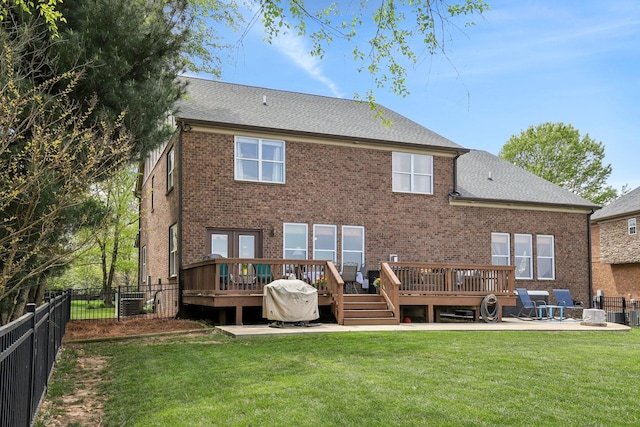 1702 Stoney Hill Ln, Spring Hill, TN 37174 - back of house with a lawn, a wooden deck, a fenced backyard, and brick siding