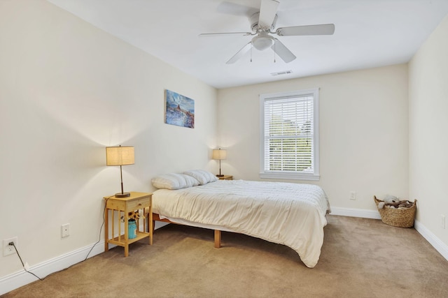 bedroom featuring carpet floors, a ceiling fan, visible vents, and baseboards