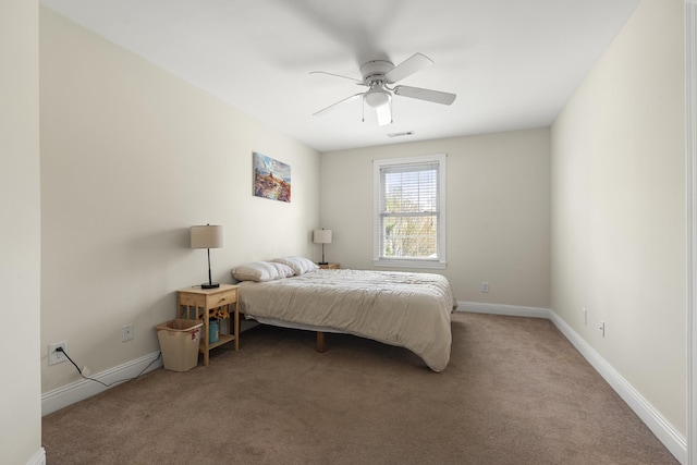 bedroom featuring carpet floors, visible vents, baseboards, and ceiling fan