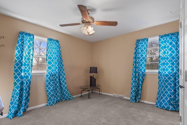 miscellaneous room featuring carpet floors, ceiling fan, visible vents, and baseboards