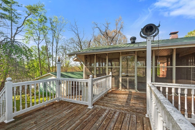 wooden terrace featuring a sunroom