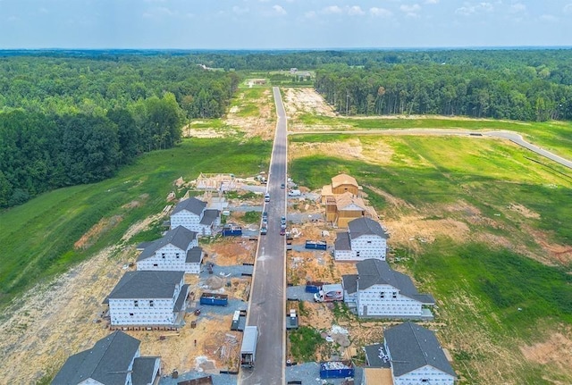 bird's eye view featuring a forest view