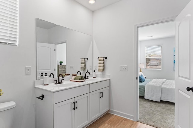 8547 Turnbull Dr, Pleasant View, TN 37146 - ensuite bathroom with double vanity, wood finished floors, and recessed lighting