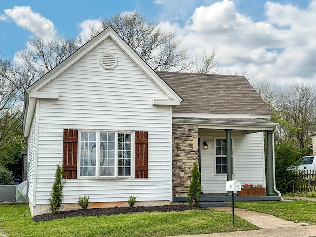 503 E Market St, Lebanon, TN 37087 - view of front of house featuring a shingled roof, stone siding, and covered porch