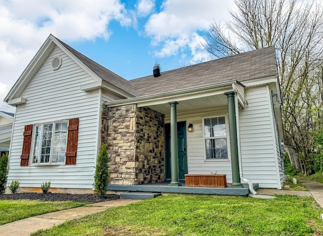 503 E Market St, Lebanon, TN 37087 - ranch-style house with a porch, a front lawn, stone siding, and roof with shingles