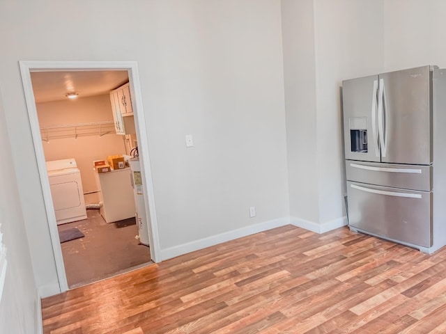 503 E Market St, Lebanon, TN 37087 - interior space with stainless steel fridge with ice dispenser, light wood-style floors, washing machine and dryer, and baseboards