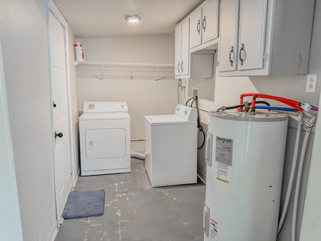 503 E Market St, Lebanon, TN 37087 - clothes washing area featuring washer and dryer, cabinet space, and water heater