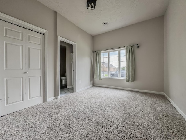 503 E Market St, Lebanon, TN 37087 - unfurnished bedroom featuring visible vents, baseboards, carpet, and a textured ceiling