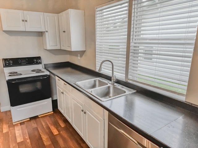 503 E Market St, Lebanon, TN 37087 - kitchen featuring dark wood-type flooring, electric range, white cabinets, a sink, and dark countertops