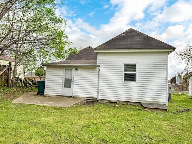 503 E Market St, Lebanon, TN 37087 - rear view of house with a patio, a yard, a shingled roof, and fence