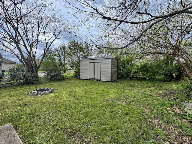 503 E Market St, Lebanon, TN 37087 - view of yard with a storage shed, a fire pit, and an outbuilding