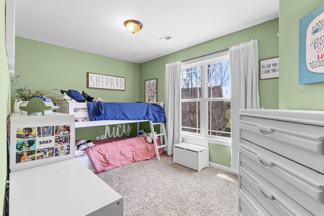 carpeted bedroom featuring visible vents and baseboards
