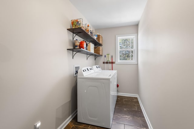 washroom with independent washer and dryer, laundry area, and baseboards