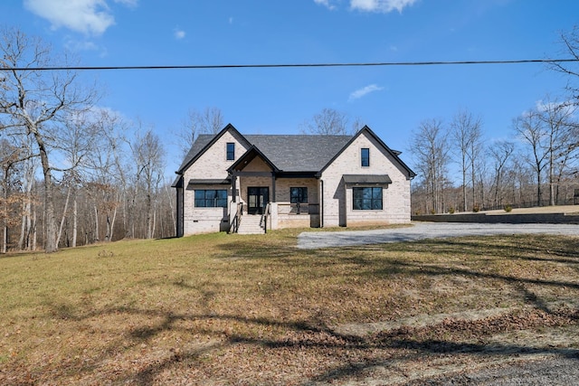 10015 Charleston Dr, Lyles, TN 37098 - view of front of property with a front yard and brick siding