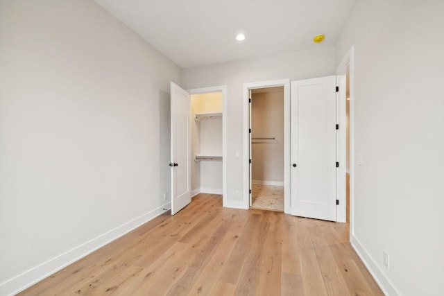 3207B Long Blvd, Nashville, TN 37203 - unfurnished bedroom with light wood-style flooring, baseboards, a spacious closet, and recessed lighting