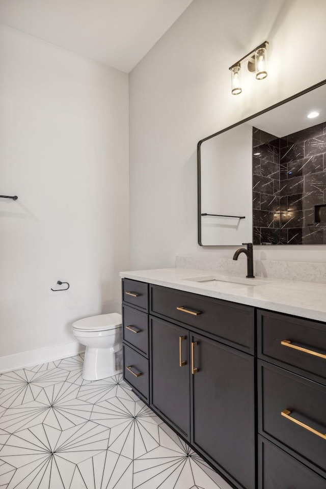 3207B Long Blvd, Nashville, TN 37203 - bathroom featuring toilet, vanity, baseboards, and tile patterned flooring