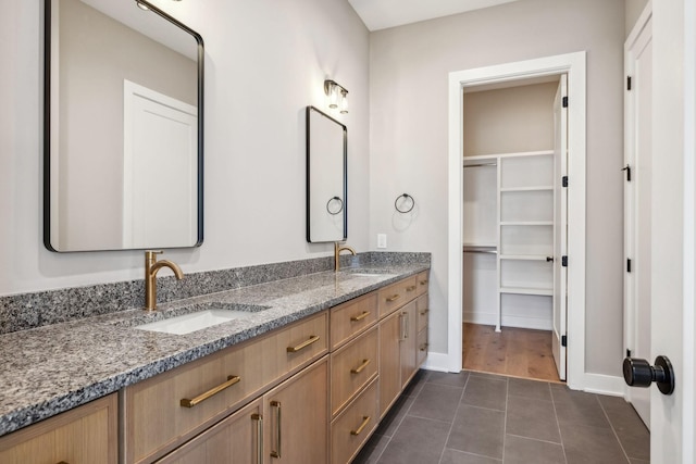 3207B Long Blvd, Nashville, TN 37203 - full bathroom with double vanity, a sink, tile patterned flooring, and baseboards
