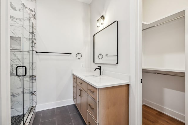 3207B Long Blvd, Nashville, TN 37203 - full bathroom featuring a marble finish shower, baseboards, and vanity