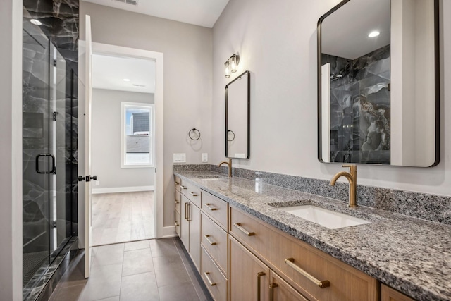 3207B Long Blvd, Nashville, TN 37203 - bathroom featuring a shower stall, tile patterned floors, double vanity, and a sink