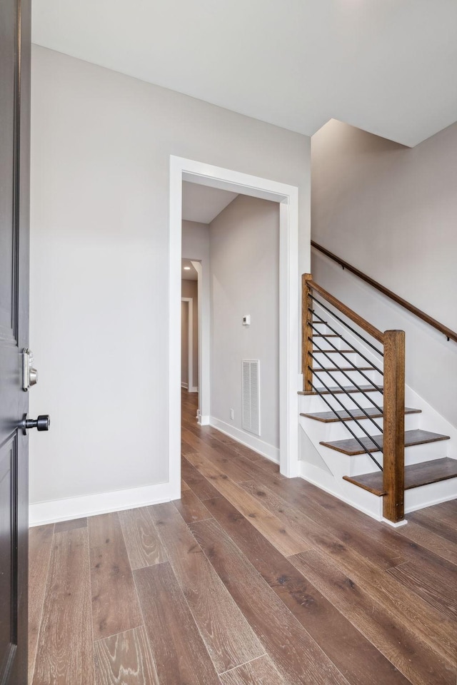 3207A Long Blvd, Nashville, TN 37203 - foyer entrance with visible vents, baseboards, wood finished floors, and stairs