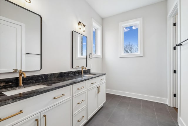 3207A Long Blvd, Nashville, TN 37203 - full bathroom with double vanity, baseboards, and a sink