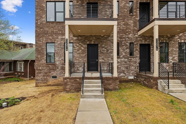 3207A Long Blvd, Nashville, TN 37203 - view of exterior entry featuring a porch, brick siding, and a balcony