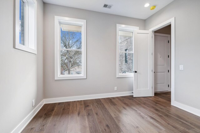 3207A Long Blvd, Nashville, TN 37203 - unfurnished bedroom with visible vents, baseboards, and wood finished floors