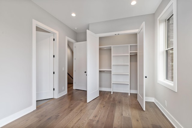 3207A Long Blvd, Nashville, TN 37203 - unfurnished bedroom with a closet, baseboards, recessed lighting, and wood finished floors
