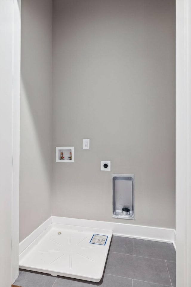 3207A Long Blvd, Nashville, TN 37203 - laundry area featuring tile patterned floors, hookup for an electric dryer, hookup for a washing machine, and baseboards