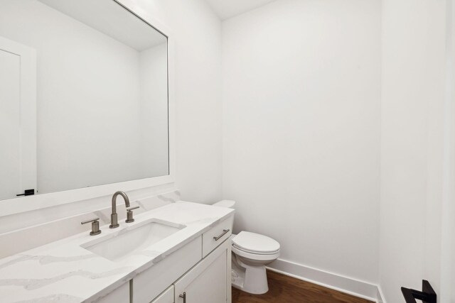 112 Shadow Springs Dr, Brentwood, TN 37027 - half bathroom with toilet, wood finished floors, vanity, and baseboards