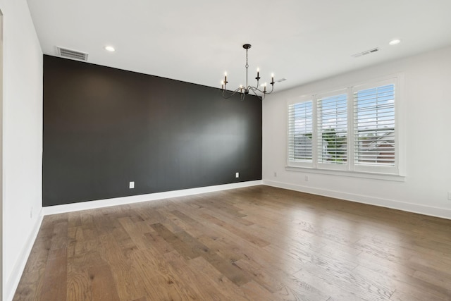 112 Shadow Springs Dr, Brentwood, TN 37027 - unfurnished room featuring visible vents, a chandelier, and wood finished floors
