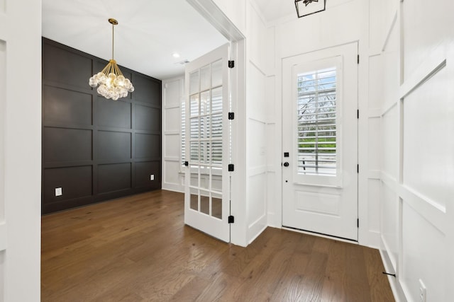 112 Shadow Springs Dr, Brentwood, TN 37027 - entryway with a chandelier, a decorative wall, and wood finished floors