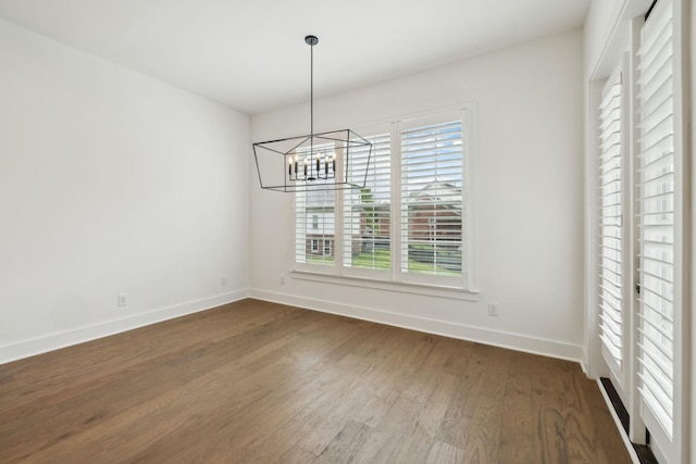 112 Shadow Springs Dr, Brentwood, TN 37027 - unfurnished dining area featuring dark wood-type flooring, an inviting chandelier, and baseboards