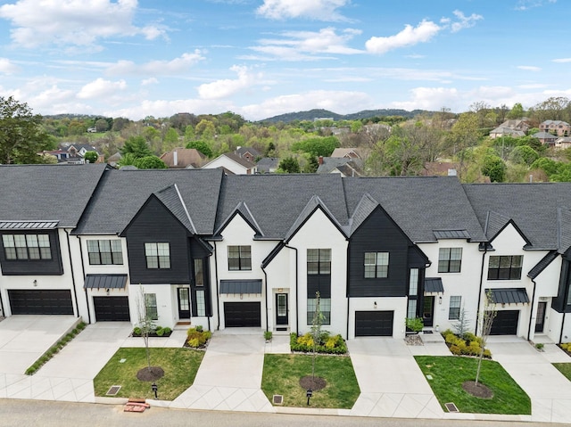 112 Shadow Springs Dr, Brentwood, TN 37027 - townhome / multi-family property featuring a standing seam roof, a residential view, and driveway